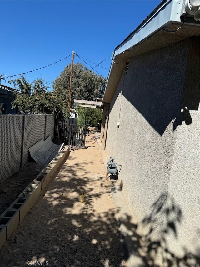 25626 Anderson Ave, Barstow, CA 92311 - view of home's exterior featuring stucco siding and fence