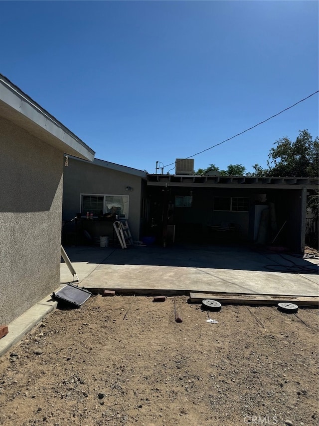 rear view of house with a patio