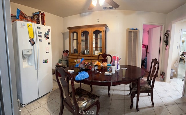 dining area with light tile patterned floors and ceiling fan