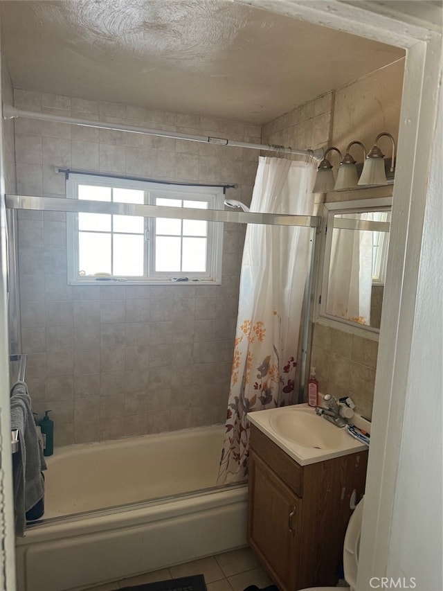 bathroom featuring vanity, shower / bathtub combination with curtain, and tile patterned floors