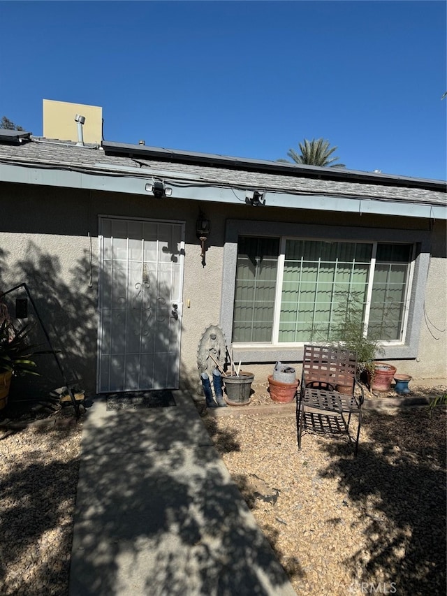 back of property featuring a patio