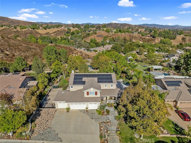 birds eye view of property featuring a mountain view