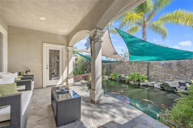 view of patio with a fenced backyard and outdoor lounge area