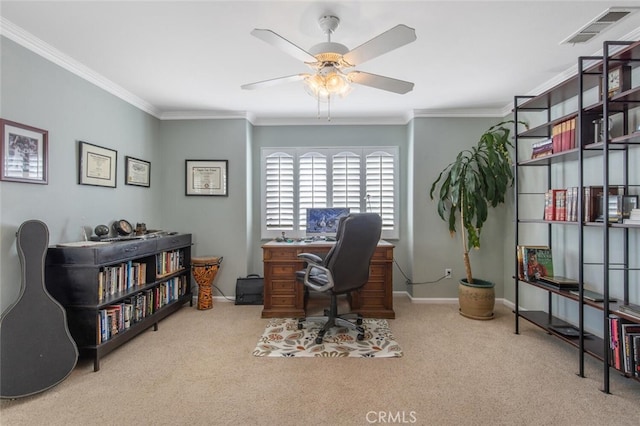 carpeted office space with ceiling fan and ornamental molding