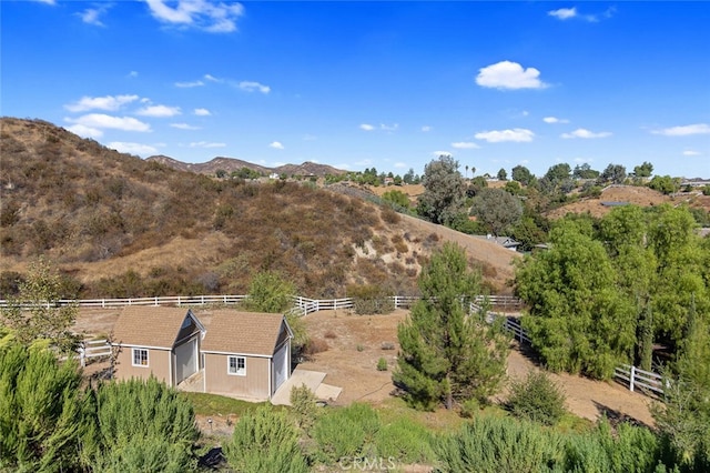 exterior space featuring a rural view and a mountain view