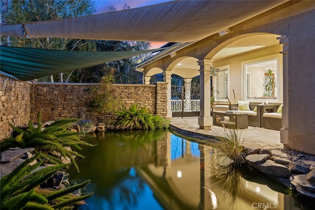 view of swimming pool featuring a patio area and fence