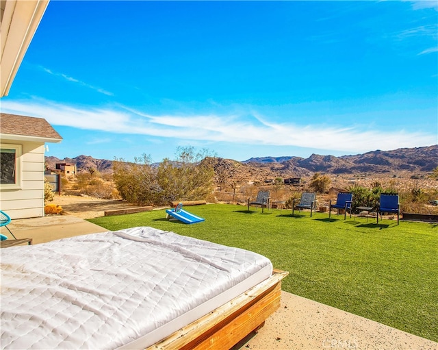 exterior space with a yard, a mountain view, and a playground