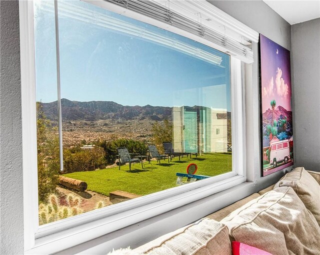 interior space with a textured wall and a mountain view