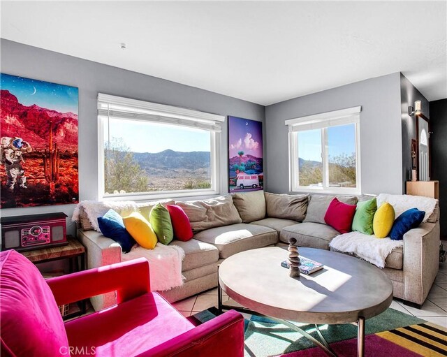 living area with tile patterned flooring and plenty of natural light