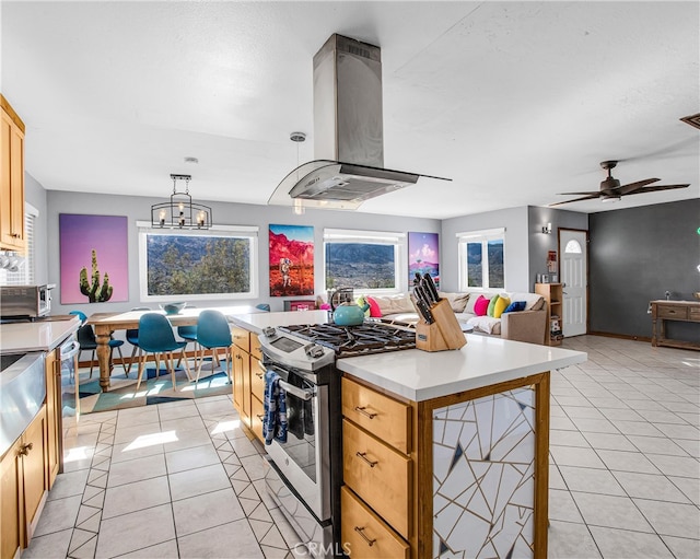 kitchen with range hood, stainless steel appliances, light tile patterned flooring, and hanging light fixtures