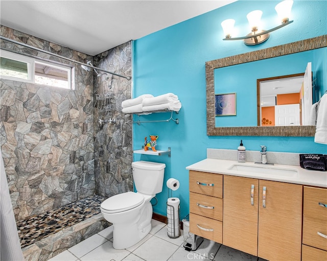 bathroom with vanity, toilet, tile patterned floors, and a shower with shower curtain