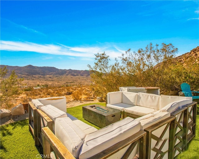 exterior space featuring a mountain view and an outdoor hangout area