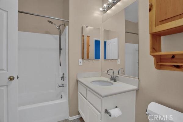 full bathroom with shower / tub combination, vanity, and toilet