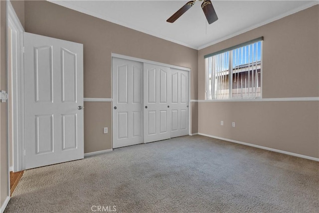 unfurnished bedroom with a closet, ceiling fan, and light colored carpet