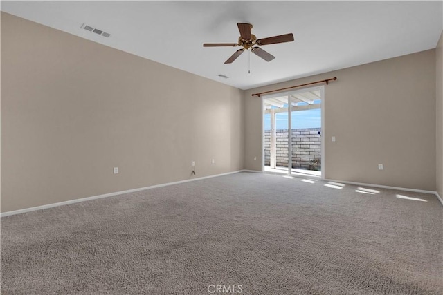 spare room featuring carpet floors and ceiling fan