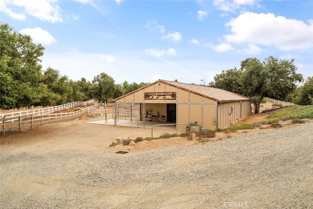 view of outdoor structure with a rural view