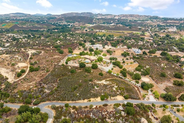 birds eye view of property featuring a mountain view