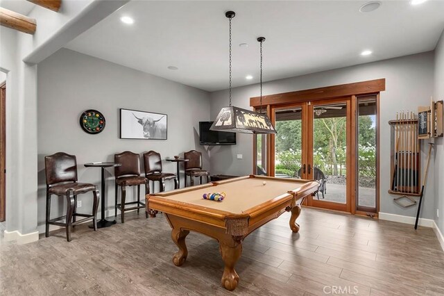 rec room with french doors, hardwood / wood-style flooring, and billiards