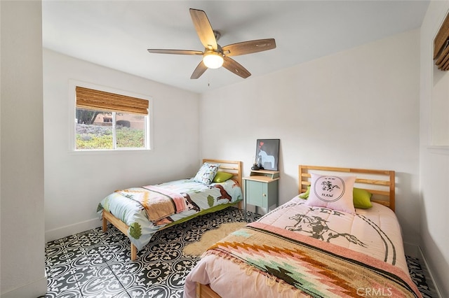 bedroom featuring ceiling fan and tile patterned floors