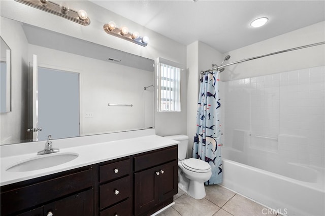 full bathroom with tile patterned flooring, toilet, visible vents, vanity, and shower / bath combo with shower curtain