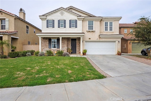 view of front of home with a garage and a front yard