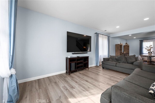 living room with light hardwood / wood-style floors