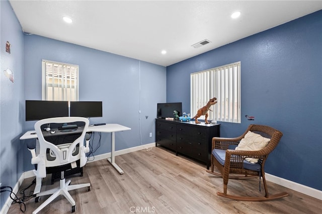 home office featuring light wood-type flooring, visible vents, baseboards, and recessed lighting