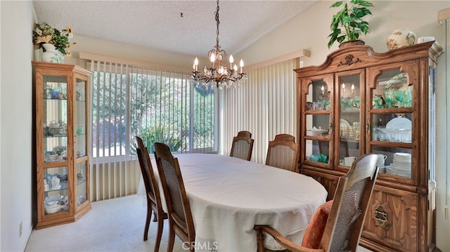 carpeted dining space with an inviting chandelier, a textured ceiling, and vaulted ceiling