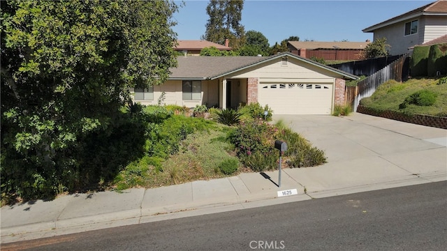 single story home with a garage