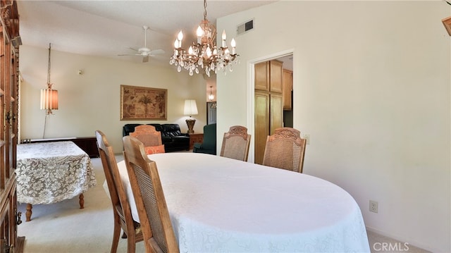 dining area with light colored carpet and ceiling fan with notable chandelier