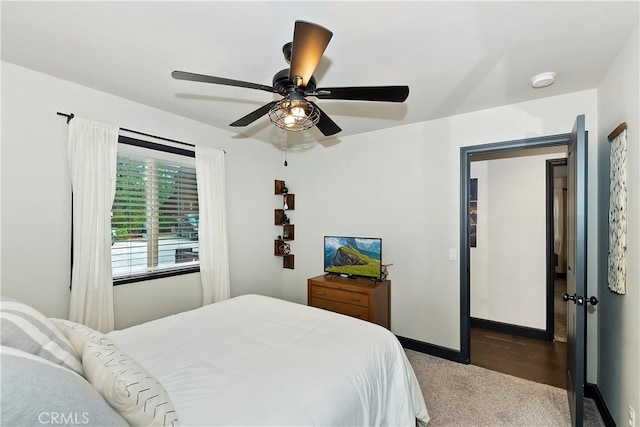 bedroom with ceiling fan and light carpet