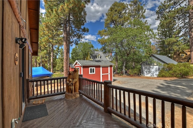 wooden deck with an outbuilding