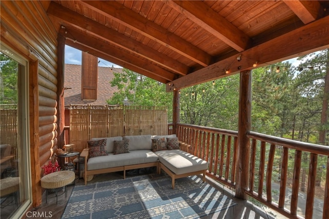 wooden terrace featuring an outdoor living space