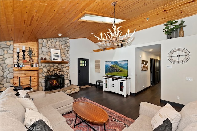 living room with a fireplace, wooden ceiling, an inviting chandelier, and dark hardwood / wood-style floors