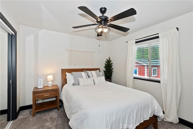 bedroom featuring ceiling fan and dark carpet