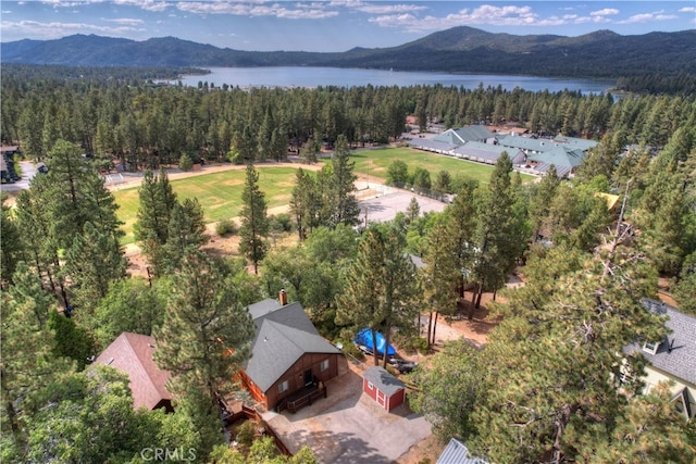 drone / aerial view featuring a water and mountain view