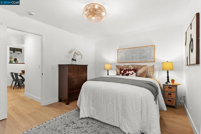 bedroom with light hardwood / wood-style flooring