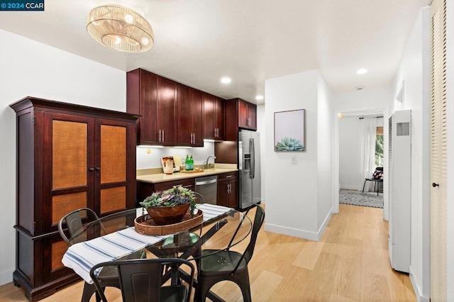 kitchen featuring light hardwood / wood-style floors, sink, and stainless steel appliances