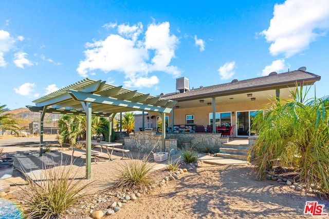 back of property with a patio area, cooling unit, and a pergola