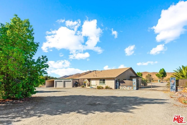 view of front of house featuring a mountain view and a garage