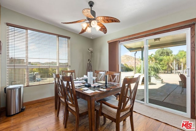 dining area featuring ceiling fan and hardwood / wood-style flooring