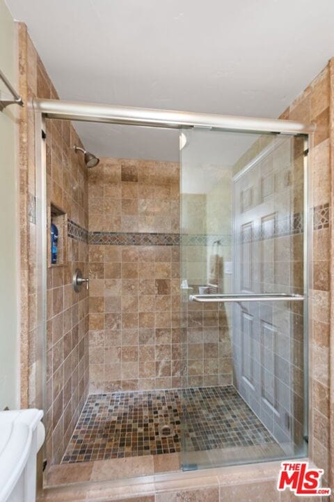 bathroom with an enclosed shower