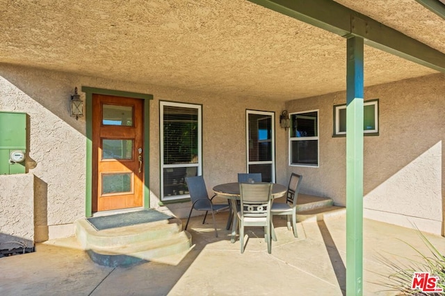 doorway to property featuring a patio