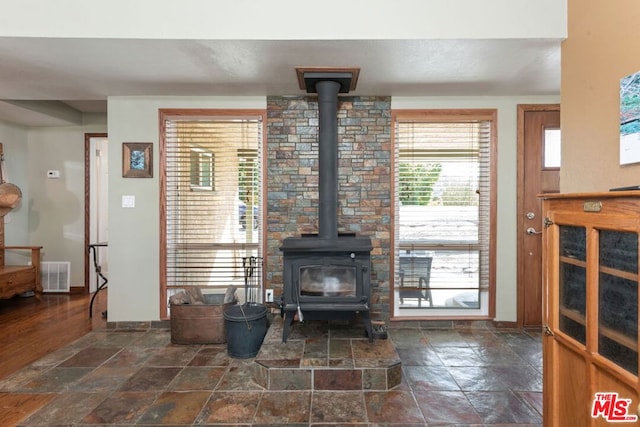 living room with a wood stove