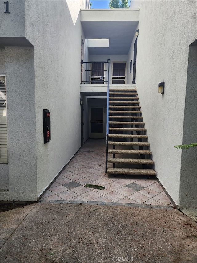 entrance to property featuring a balcony