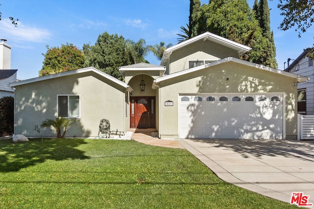 view of front facade with a front yard and a garage