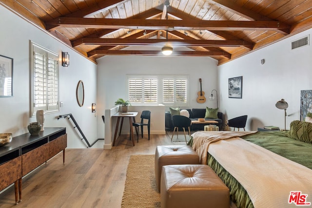 bedroom with vaulted ceiling with beams, light hardwood / wood-style floors, and wood ceiling