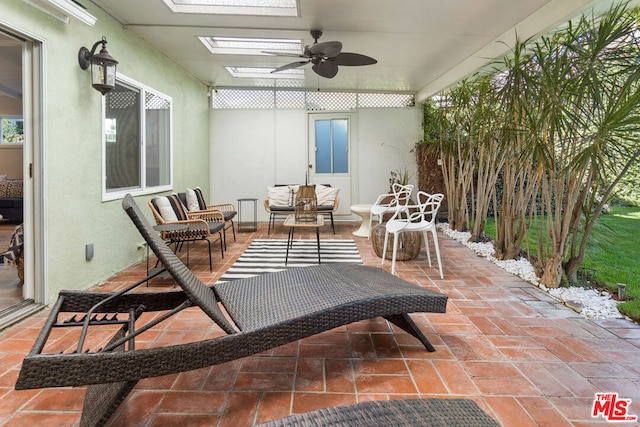 exterior space featuring an outdoor hangout area and ceiling fan