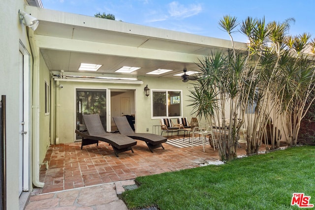 view of patio / terrace featuring ceiling fan