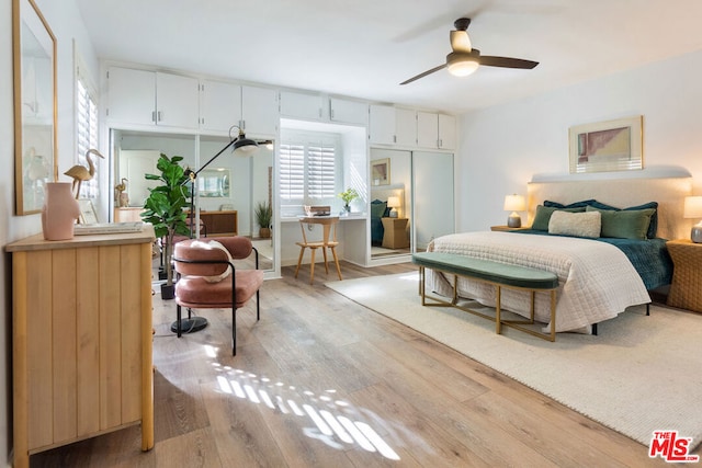 bedroom with ceiling fan and light hardwood / wood-style floors